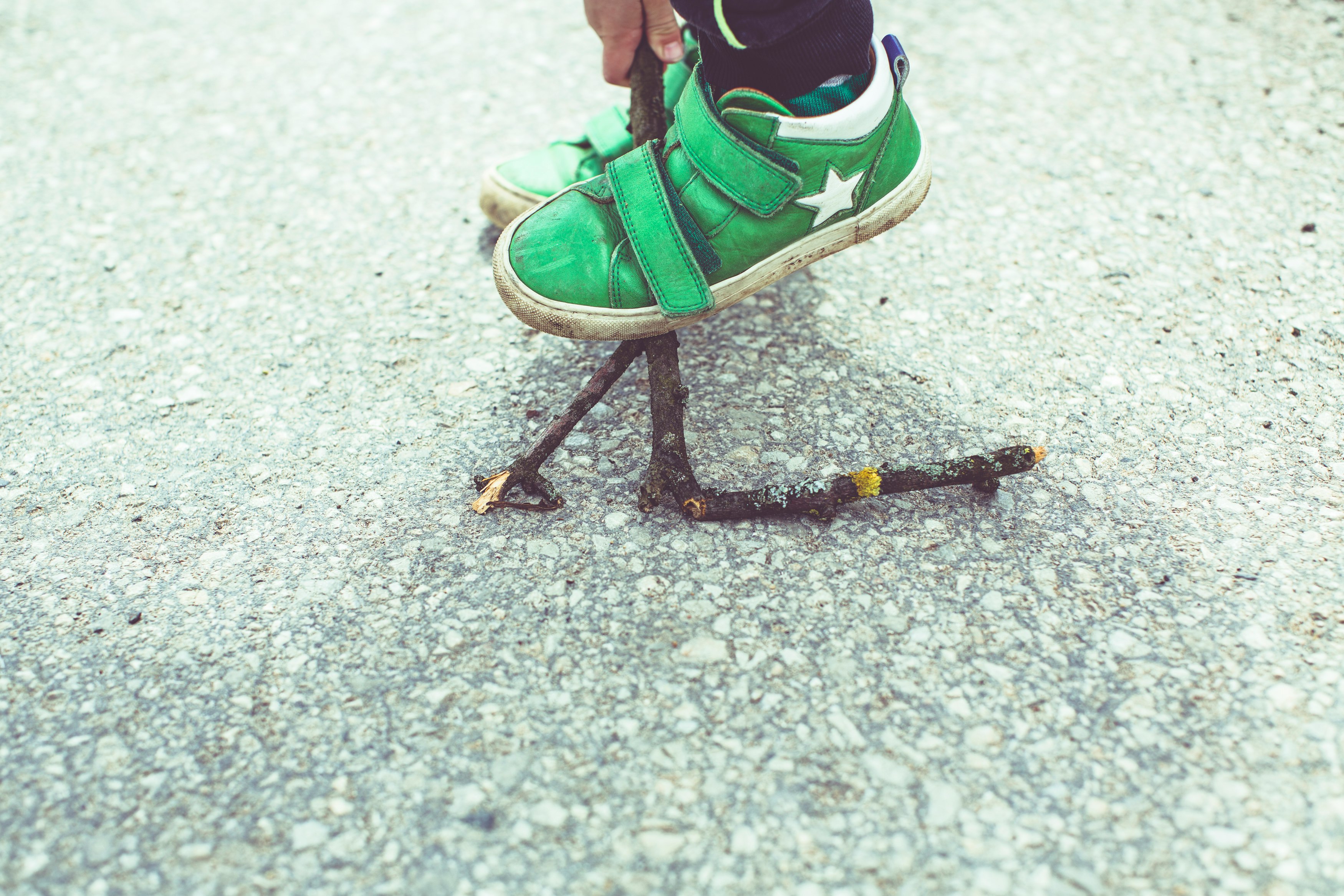 person in green and white nike sneakers